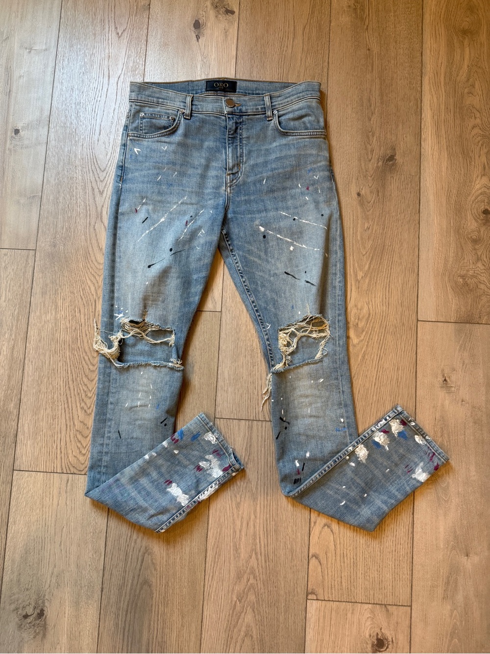 ORO Light Wash Denim Jeans with Gold Logo Patch